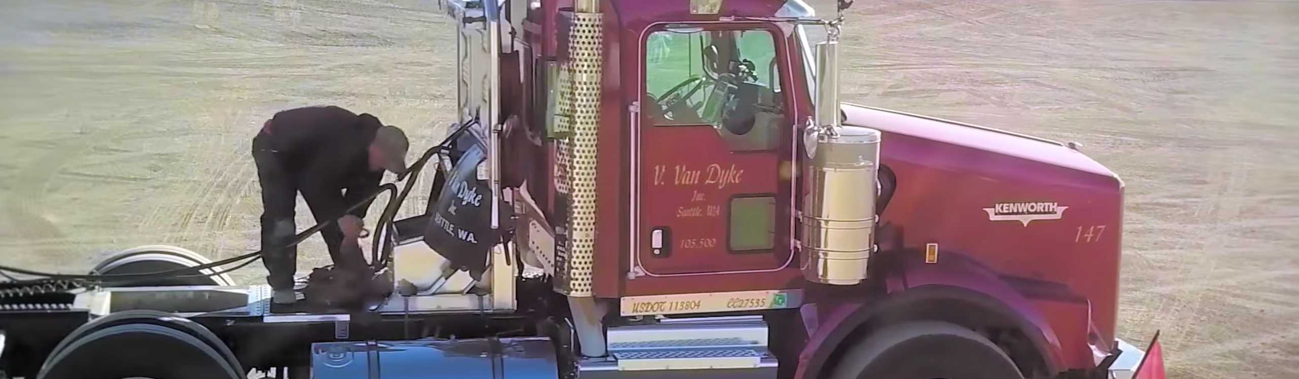 Truck driver fueling up