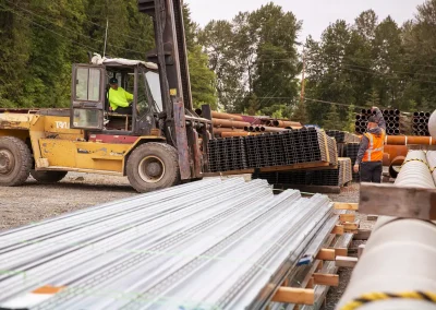 Forklift picking up steel studs