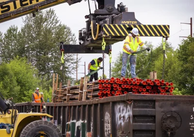 V. Van Dyke riggers preparing transload of pipes